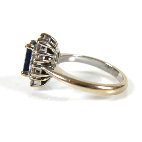 273 - An 18ct white gold sapphire and diamond ring, head 12 by 10mm, size I, 5.5g.