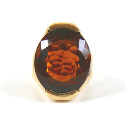 249 - A 9ct yellow gold citrine dress ring, head size 22 by 16mm, size N, 22.7g.