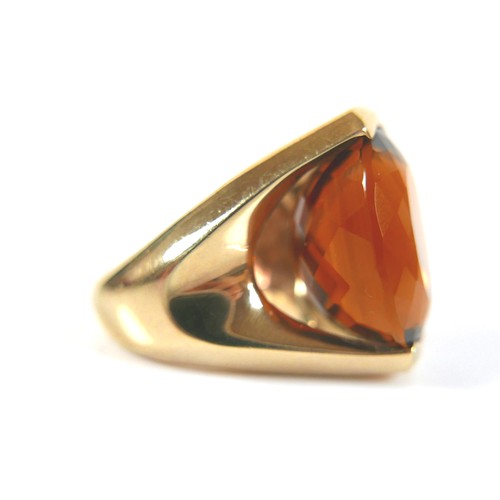 249 - A 9ct yellow gold citrine dress ring, head size 22 by 16mm, size N, 22.7g.