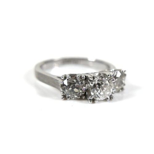 293 - A 14ct white gold three stone diamond ring, the central stone approximately 0.50ct, flanked by sligh... 