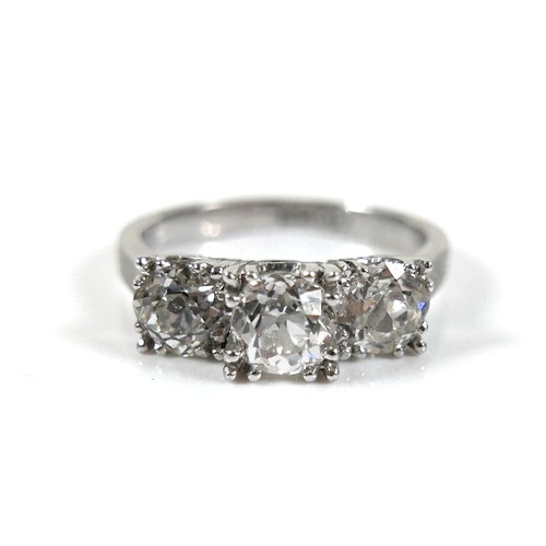 293 - A 14ct white gold three stone diamond ring, the central stone approximately 0.50ct, flanked by sligh... 