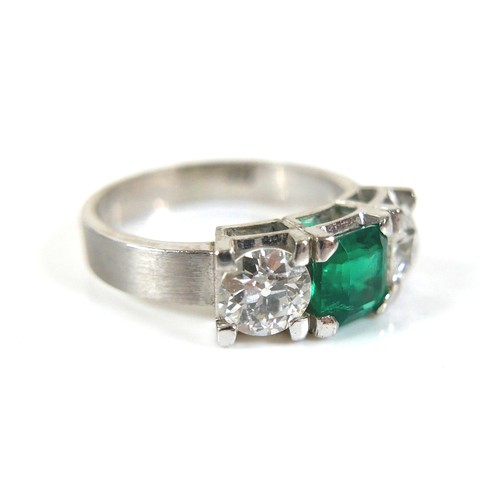 304 - A 14ct white gold diamond and emerald type three stone ring, each diamond approximately 0.48ct, 4.5g... 