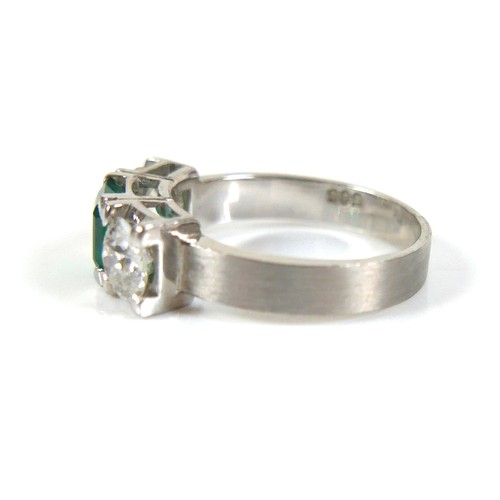 304 - A 14ct white gold diamond and emerald type three stone ring, each diamond approximately 0.48ct, 4.5g... 