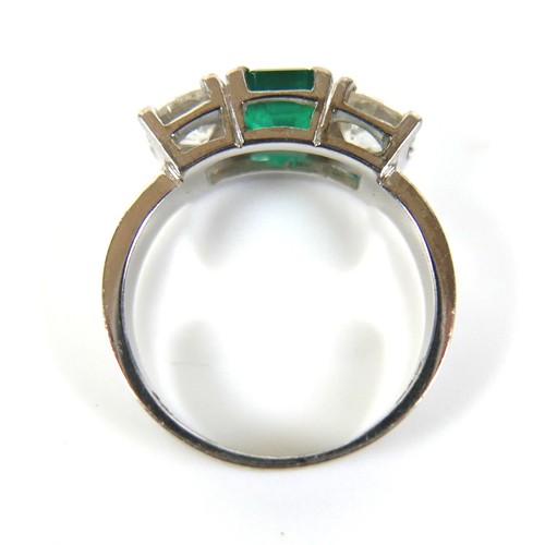 304 - A 14ct white gold diamond and emerald type three stone ring, each diamond approximately 0.48ct, 4.5g... 