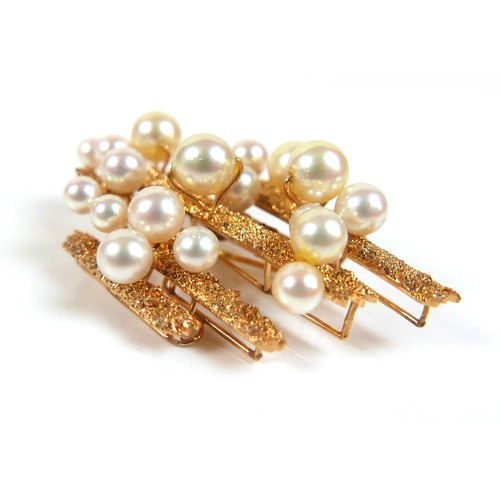 285 - A vintage 14ct textured yellow gold brooch, set with eighteen pearls, marked '14K 585 FJ', 55 by 35m... 