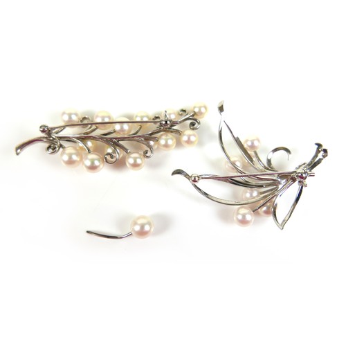 230 - Two Mikimoto pearl and white metal brooches, 65 and 50mm high. (2)