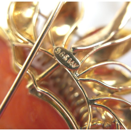 303 - A 14ct yellow gold coral brooch, carved as a flower, 90mm by 55mm, 52.3g.