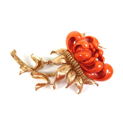 303 - A 14ct yellow gold coral brooch, carved as a flower, 90mm by 55mm, 52.3g.