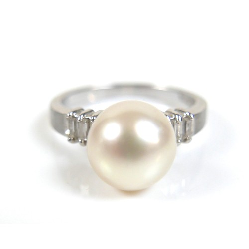 274 - A 14ct white gold, diamond and pearl ring, size L/M, and a pair of near matching earrings, pearls 9 ... 