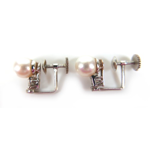 274 - A 14ct white gold, diamond and pearl ring, size L/M, and a pair of near matching earrings, pearls 9 ... 