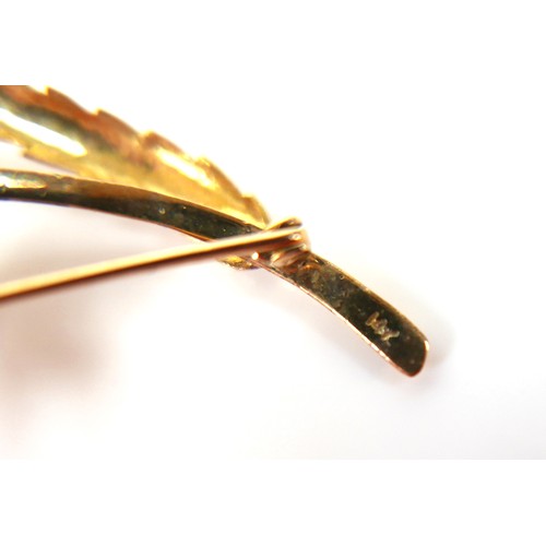 284 - A 14ct yellow gold tourgoise leaf brooch and a pair of matching screw back earrings, brooch measures... 