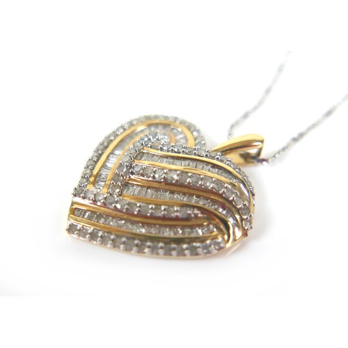 215 - A 10ct white and yellow gold diamond heart shaped pendant necklace, the pendant with baguette cut st... 