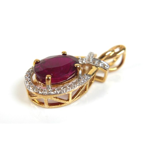 176 - A 9ct gold red tourmaline and white zircon oval form pendant, the tourmaline approximately 7 by 9mm,... 