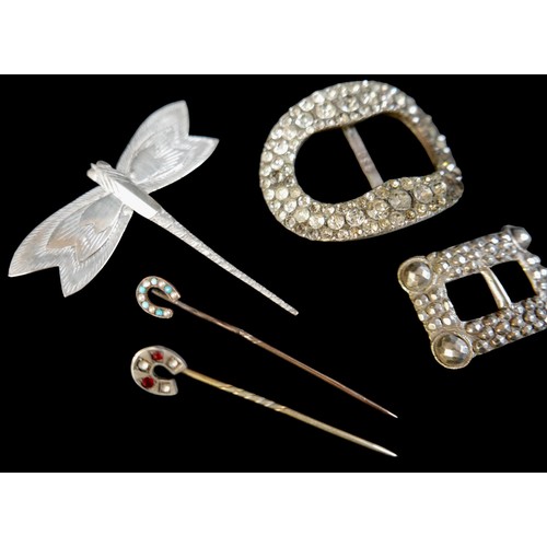 155 - A varied collection of five gilt pins, silver dragonfly brooch, and nine buckles. (15)