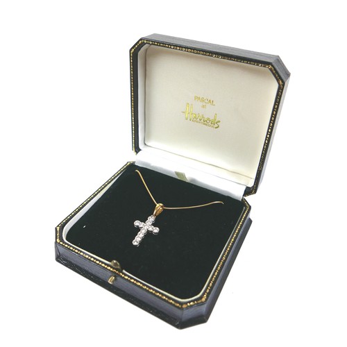 297 - An 18ct white and yellow gold diamond set cross shaped pendant, by Pascal at Harrods, the cross set ... 