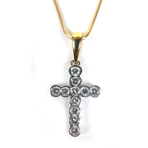 297 - An 18ct white and yellow gold diamond set cross shaped pendant, by Pascal at Harrods, the cross set ... 