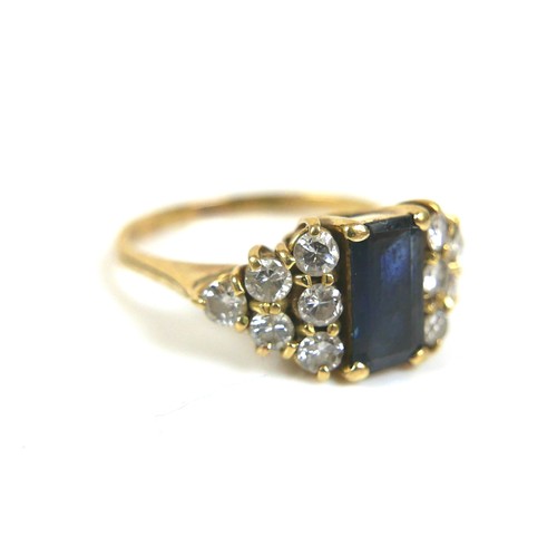 246 - An 18ct gold, sapphire and diamond ring, circa 1986, the central square cut sapphire, 7.8 by 4.5 by ... 