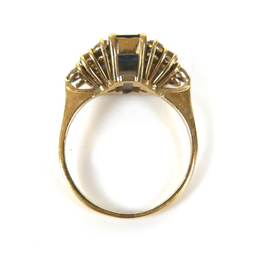 246 - An 18ct gold, sapphire and diamond ring, circa 1986, the central square cut sapphire, 7.8 by 4.5 by ... 