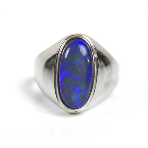 194 - An 18ct white gold ring, set with an oval opal, 13.0 by 6.5mm, on a plain tapering band, size P, 5.1... 