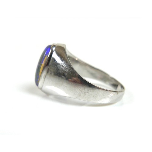 194 - An 18ct white gold ring, set with an oval opal, 13.0 by 6.5mm, on a plain tapering band, size P, 5.1... 