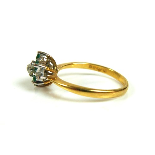 191 - An 18ct yellow gold flowerhead ring, set centrally with an old cut diamond, 3.5mm, surrounded by six... 