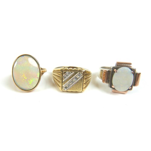 244 - A group of five 9ct gold rings, including one set with an oval opal, 18 by 14mm, size Q, a white gol... 