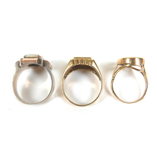 244 - A group of five 9ct gold rings, including one set with an oval opal, 18 by 14mm, size Q, a white gol... 