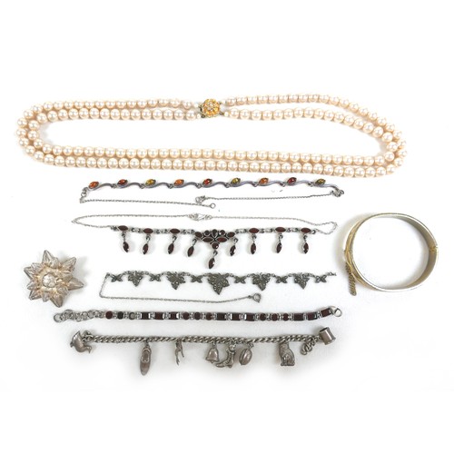 148 - A group of costume jewellery, including a two strand pearl necklace, a silver flowerhead filigree br... 