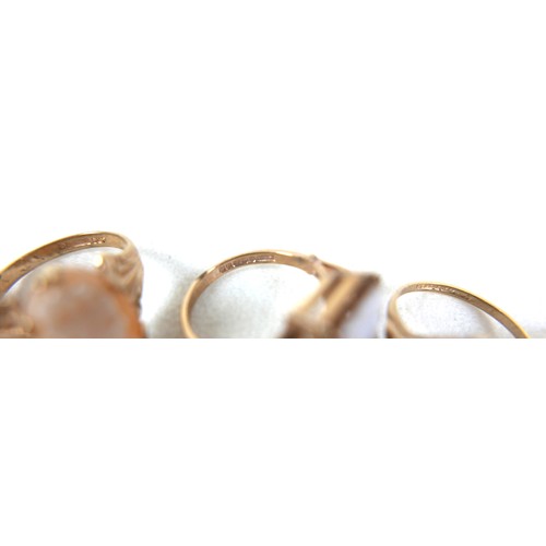 242 - A group of five 9ct gold cameo rings, sizes J to O, largest 15 by 10mm, 11.7g total. (5)