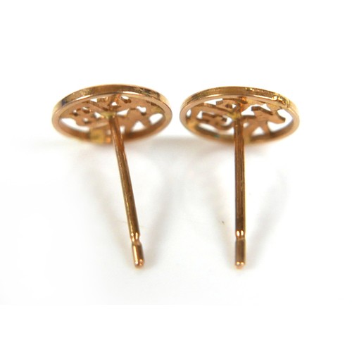 135 - A pair of yellow gold stud earrings, each of circular form with a Chinese character, post fittings b... 