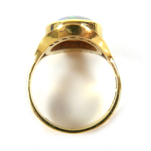 287 - An 18ct gold, opal and diamond ring, centered by a round cabochon opal, 10.5mm, pave set above and b... 