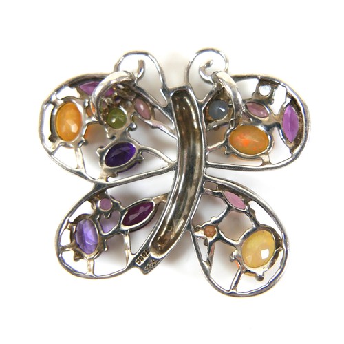 142 - A vintage 925 silver multi gem pendant, in the form of a butterfly, 42 by 38mm.