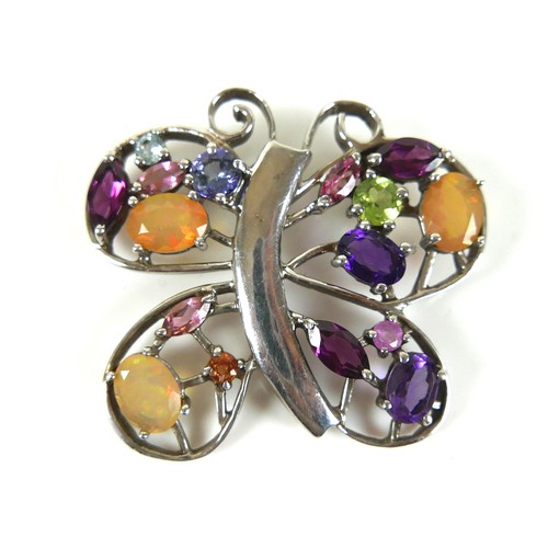 142 - A vintage 925 silver multi gem pendant, in the form of a butterfly, 42 by 38mm.