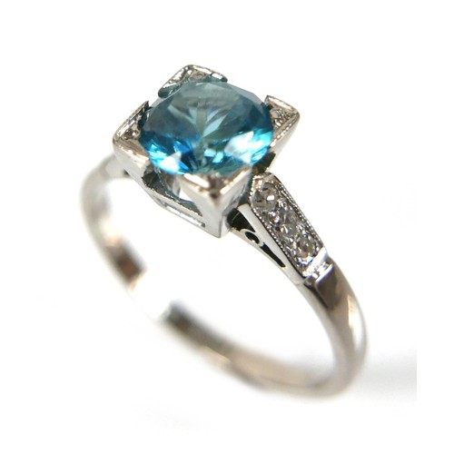 228 - An 18ct white gold and platinum, blue topaz and diamond ring, head size 7 by 7mm, set with diamond s... 