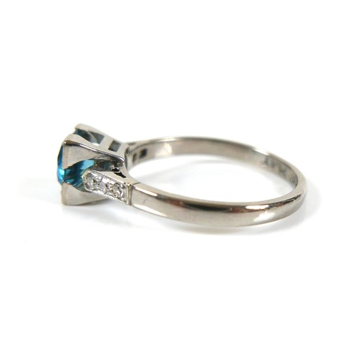 228 - An 18ct white gold and platinum, blue topaz and diamond ring, head size 7 by 7mm, set with diamond s... 