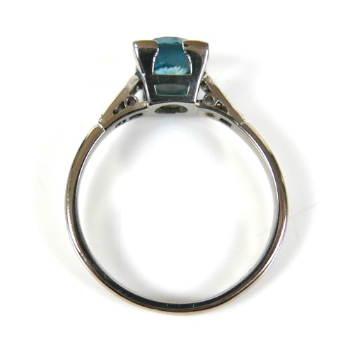 228 - An 18ct white gold and platinum, blue topaz and diamond ring, head size 7 by 7mm, set with diamond s... 