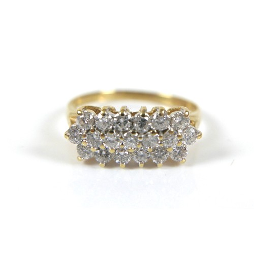 277 - An 18ct yellow gold three row diamond ring, head approximately 16 by 8mm, ring size N/O, 2.8g.