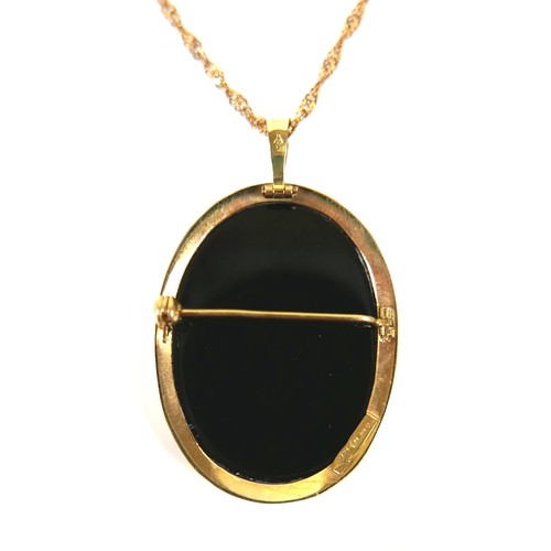 258 - An 18ct yellow gold and onyx cameo pendant, carved a a classical lady in profile, 25 by 32mm, on a 9... 