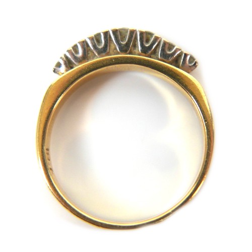 240 - An 18ct yellow gold and diamond ring, set with a gently bowed row of seven round cut stones, 2.5 to ... 