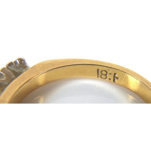 240 - An 18ct yellow gold and diamond ring, set with a gently bowed row of seven round cut stones, 2.5 to ... 