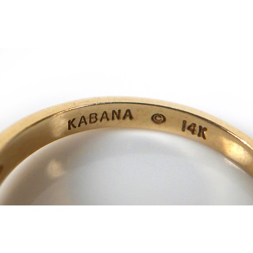 159 - A 14k yellow gold ring, by Kabana, with a single band of onyx, 6.2 by 3.0mm, on a tapering band, 2.0... 