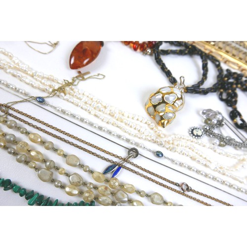 201 - A collection of costume jewellery, including a green stone set bracelet, a pair of Chinese white sto... 