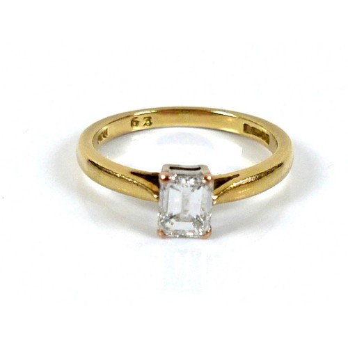 301 - An 18ct yellow gold and diamond solitaire ring, the emerald cut stone, 1.2ct, 5.5 by 4.3 by 2.9mm, i... 