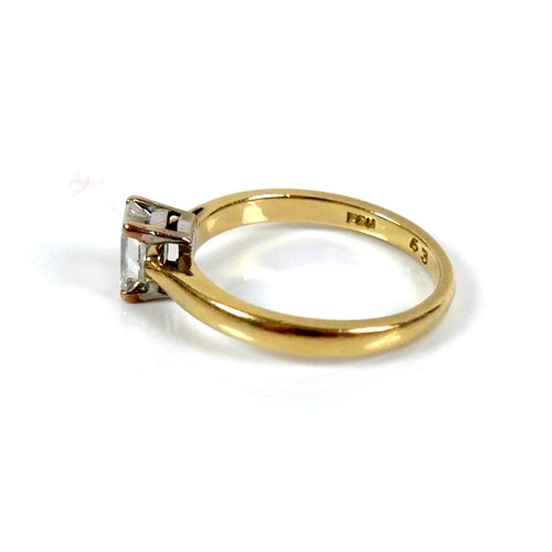 301 - An 18ct yellow gold and diamond solitaire ring, the emerald cut stone, 1.2ct, 5.5 by 4.3 by 2.9mm, i... 