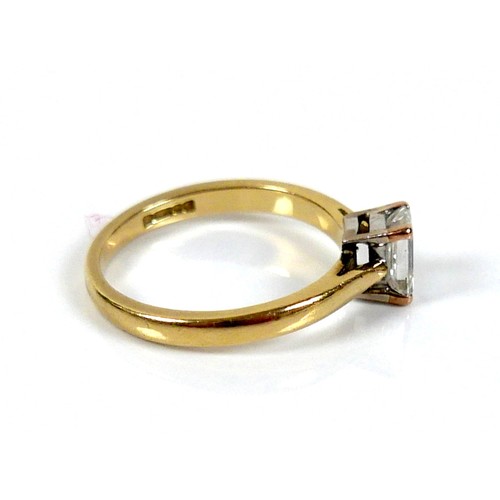 301 - An 18ct yellow gold and diamond solitaire ring, the emerald cut stone, 1.2ct, 5.5 by 4.3 by 2.9mm, i... 