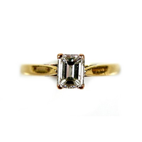 301 - An 18ct yellow gold and diamond solitaire ring, the emerald cut stone, 1.2ct, 5.5 by 4.3 by 2.9mm, i... 