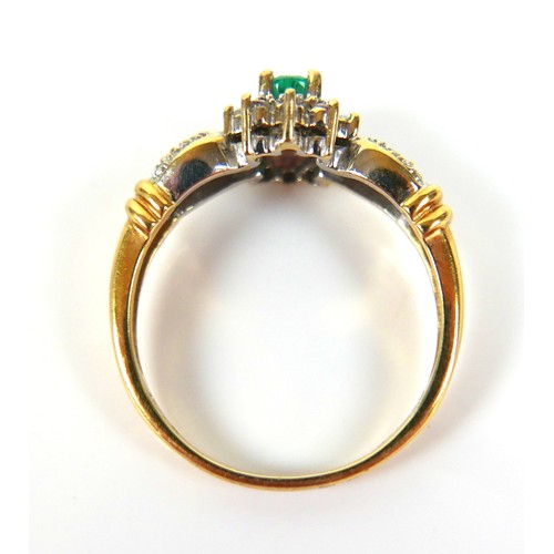 226 - An 18ct gold emerald and diamond daisy cluster ring, the oval cut emerald approximately 3.5mm by 4.5... 