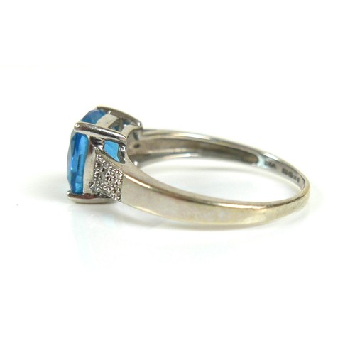 174 - Two 9ct white gold blue stone dress rings, possibly topaz, comprising a square cut stone ring, centr... 