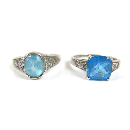 174 - Two 9ct white gold blue stone dress rings, possibly topaz, comprising a square cut stone ring, centr... 