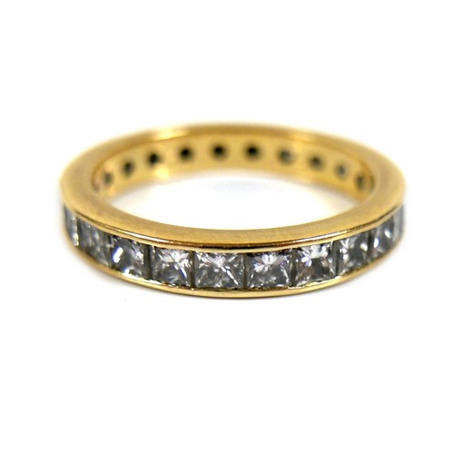 310 - An 18ct yellow gold and diamond full eternity ring, set with twenty five princess cut stones, each a... 